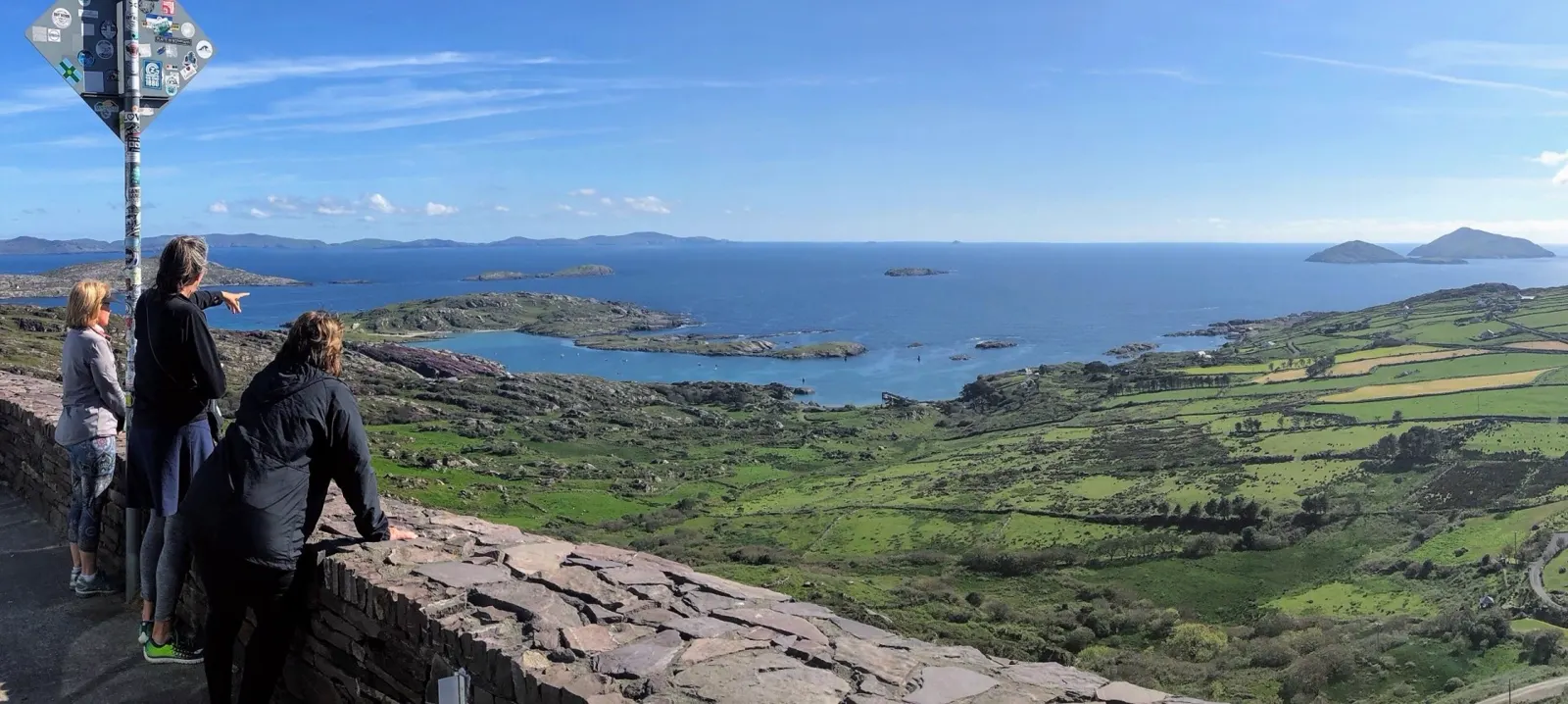 Visitors looking out over the coastline of the Wild Atlantic Way